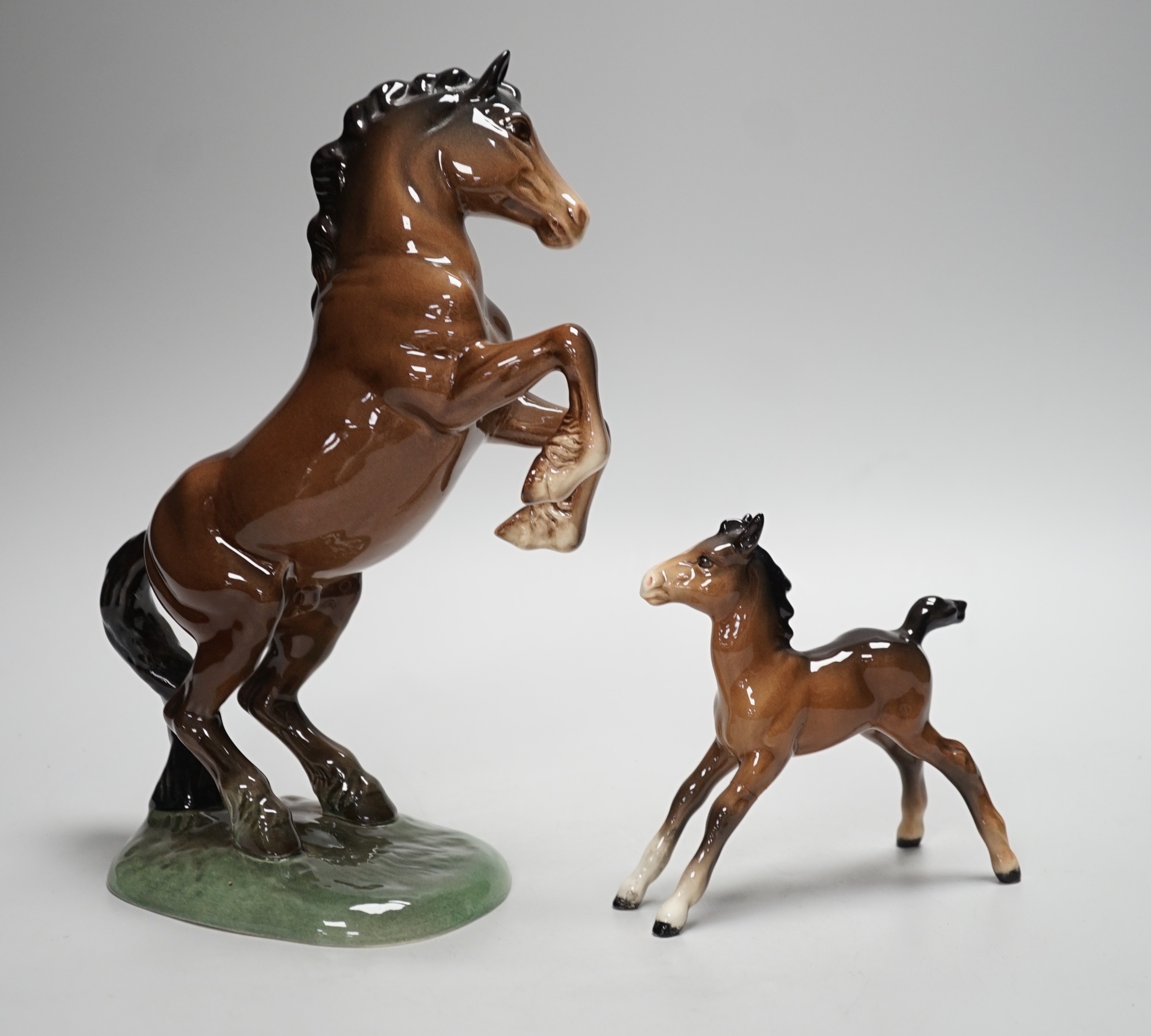 Two Beswick models of horses, one rearing and the other a foal. Tallest 27cm